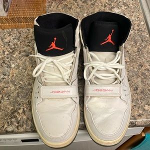 White Nike Jordans orange trim